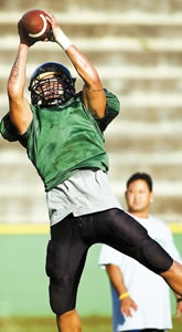 Micah Abreu-Laybon, a star rusher for the Leilehua Mules, shags a pass during a recent practice in Wahiawa. Photo by Byron Lee, staff photographer.