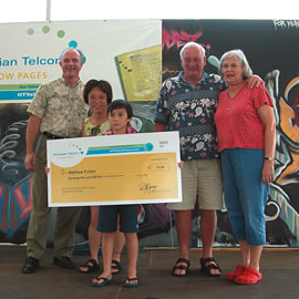 Mililani Waena Elementary School student Matthew Fulton is congratulated on his second place win in the K-2 grade division of the Hawaiian Telcom Yellow Pages art contest. With him are Ron Montgomery of Hawaiian Telcom and family members Robin, Matthew, Steve and Ruthann Fulton. Photo courtesy of Hawaiian Telcom Yellow Pages.