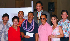 Bryson Espresion (with lei), winner of the National Art Contest, is recognized at a reception on June 28 at Honolulu Hale. Celebrating his win are Craig Higa, Rose Ancheta, Wallace Watanabe, Mayor Mufi Hannemann, Rosendo Ancheta, Gemma Espresion and Michael Pili Pang. Photo courtesy of the City and County of Honolulu.