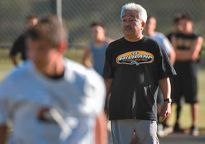 Mililani High School head basketball coach Ed Gonzales gets players up to speed during a recent practice.