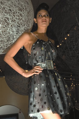 Nalani Itomura: Indashio black and platinum polka dot cocktail dress with platinum belt $4,500