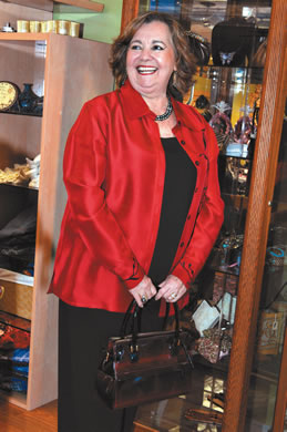 Teresita Clancey: Coldwater Creek red blouse $35, Maxximum handbag $35