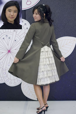 Lauren Lee: Twill coat with tea-dyed eyelet lace bustle in back modeled by Rachel Kamita.
