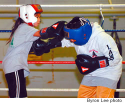 Jada Periera, left, spars with Lawrence Paelma