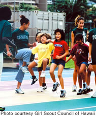 Girls at last year’s Sports Day take part in a track and field clinic