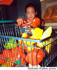 Jonah Kawamura learns to make healthy food choices on a visit to Sesame Street Presents: The Body at Bishop Museum