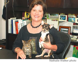 Hawaiian Humane Society CEO Pamela Burns hangs out with her friends “Katie” the kitten and “Miracle” the puppy