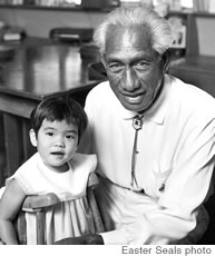 In a historical photo, Duke Kahanamoku visits with Dani