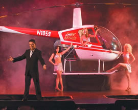 Dirk Arthur’s Xtreme Magic show has been wowing audiences for a year at the Tropicana. Uh, where’d that chopper come from?