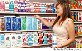 Mia Inoshita, a registered dietitian at Meadow Gold, shows off the different types of milk available today