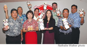 The Meadow Gold sales team — (front, from left) Henry Lee, Harolyn Toma, Cheryl Shintani, Craig Higa, and (back) Mike Kaya, Tyler Ching, Jerry Linville and Layne Kaita — show off Meadow Gold’s newest additions: The Skinny Cow and Root Beer Float Fat Free Skim Milk