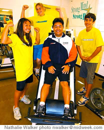 Gregg Agena with, from left, Mari Miyashiro, Hannah Hargis and Justyn Houser in the weight room