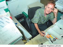Stan crunching numbers in his cubicle at MidWeek/Star-Bulletin’s Kaneohe plant