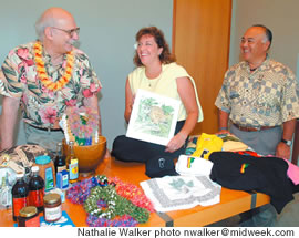 (from left) Dick Botti, Amy Hammond and Ray Ono show off items that will be on sale at the Made In Hawaii Festival in August