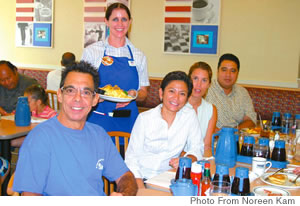 Starting the day with pancakes: (standing) IHOP server Kelley O’Neill; seated (from left): Jeffrey Apaka of Waikiki Community Center, Sarah Espino, Stacey Acma, Michael Robinson of Hawaii Pacific Health