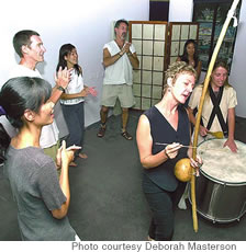 Deborah Masterson (center with instrument) leads a TaKeTiNa class