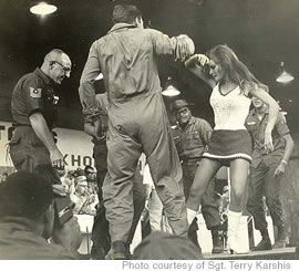 Actress Raquel Welch dances with troops during a USO tour in the 1960s, including Master Sgt. Henry Karshis, father of Air Force Senior Master Sgt. Terry Karshis, who is pictured on the cover