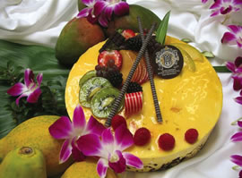 The Top Of The Mark’s exotic mango and coconut mousse cake has an island flair