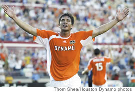 Brian Ching salutes Houston fans after giving them a convincing 5-2 victory on opening day