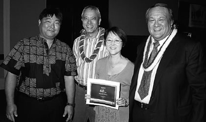 chairman of the board Don Orton, Helen and Charles Fong and former recipient Bob Graham