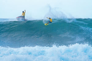 Its all about partnership in tow surfing: Garrett MacNamara and Kealii Malama at Puena Point during the Bank Of Hawaii North Shore Tow-In Championships