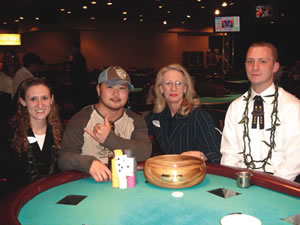 Hawaii Poker Club tournament director Jennifer, champion Kendall, tournament director Carol and dealer Paul