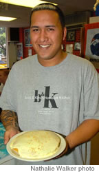 Assistant manager Austen Kaikona with Boots and Kimo’s house signature macadamia nut pancake
