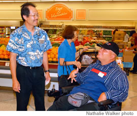 Johnny B on the job at Safeway-Mililani with manager Gary Young