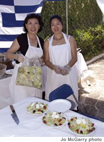 Volunteers at the Greek Festival serve Greek salad