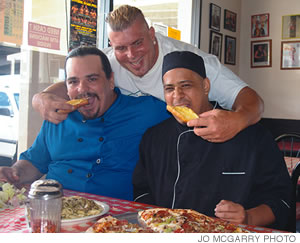 Joe Tramontino, Anthony Romano and Dave Heart chow down at Antonio's New York Pizzeria