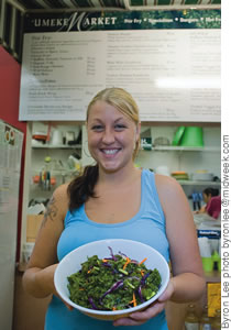 Angie Koclanes shows off her organic kale salad at 'Umeke Market