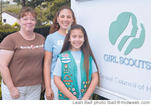 (from left) Jennifer Frisbee, Annette Martinez and Junior Girl Scout Karanina Martinez want to help you become more energy efficient 