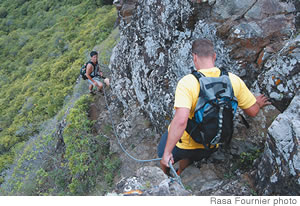 Guide Yeayin Saepae, below, and Craig Stier navigate a narrow trail