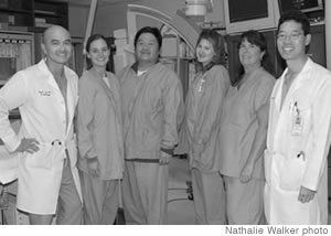 Dr. Paul C. Ho with assistant lead technician Stacey Tamashiro