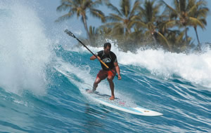 Brian Keaulana, who grew up at Makaha, powers down a wave