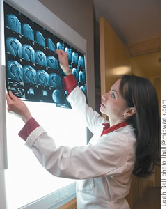 Dr. Elizabeth Ignacio checks out a patient's X-rays