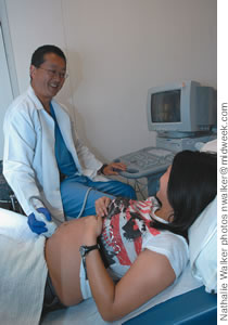 Dr. Ogasawara performs an ultrasound on patient Ashley Bulosan