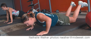 Kristin Herrick continues the workout with push-ups