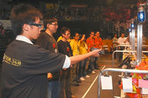 The McKinley High team operates its bot by remote control