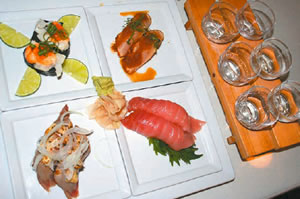 A sampling of Sansei's new sushi dishes and two sake samplers