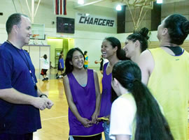 Coach Mike Morton shares a light moment with Pearl City seniors Tazha Passi, Lindsay Cartwright, Crystal Tadeo, Channette Nakama and Tiffany Manning. Photo by Byron Lee, staff