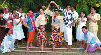 The Tinikling Dance Group and cast of “To U.S. With Aloha and Mabuhay” perform a traditional Filipino dance. Pictured are (kneeling) Lydia Abajo-Quides and James Ramos, (standing) Michelle Csigi, Sam Sil-Yun Cannon, Marilyn Csigi, Alysia Ignacio, Jesus Basuel, Lito Capina, Shirley Castillo, Cythia Ochoa, Kevin Agtarap, Johnny Verzon, Chloe Amos and Loren Farmer. Photo courtesy of The Actors Group.