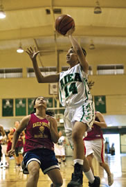 Aiea sophomore Natasha Helsham goes up against the Dalles High team from Seattle. Photo by Byron Lee