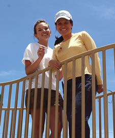 Eliza Talbot and state Rep. Kymberly Pine help build a playground for Waianae keiki on June 23. Photo by Kyle Karioka.