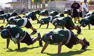 The Aiea football team warms up. Photo by Leah Ball, <span id='eeEncEmail_tFdvvIXDPI'>.(JavaScript must be enabled to view this email address)</span><script type=