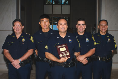 Maj. Michael Moses, Officers Fumi Muraoka, Art Takamiya and Mark Ramos, and Sgt. Edgar Namoca