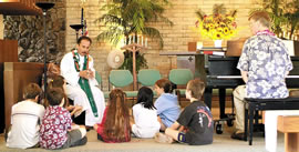 The Rev. Darren Galindo talks with the younger members of his flock at Windward United Church of Christ in Aikahi. Photo from Lucinda Keller.
