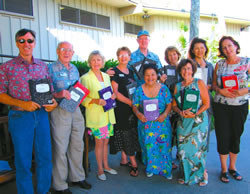 A recent meeting of Realtors at Mid-Pacific Country Club also netted 750 composition books for area students via Community Helping Schools. Donors are (front) Cecilia Christenson and Kathie Wells; (back, from left) Mark Pillori, Stewart Wade, Holly Turi, Pat and Don Baxter, Lynn Tilton, Dale Bordner and Sharon Trehern. Not pictured are Bob Ogorchock, Donna Maier, Joyce Cramer, Thia West, Sara VanDerWeff, Pam McIntyre, Connie Rodriques, Liz Moore, Terry Ewart and others in Realtors Networking on Oahu. Photo from Kathie Wells.