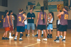 Castle High School Knights coach Jeff McKeown talks with his girls basketball team. Photo by Nathalie Walker