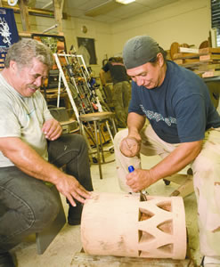 David Hanawahine learns drum-making from Cioci Dalire at a woodworking program at Windward Community College. Photo by Leah Ball